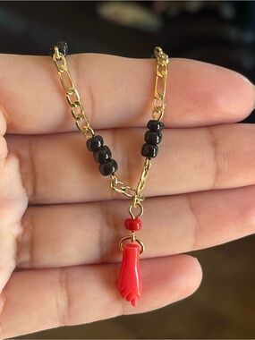 Gold Chain Bracelet with Black Beads and Red Hand Pendant